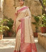 Ivory and pink banarasi silk saree with golden zari – regal elegance for timeless celebrations