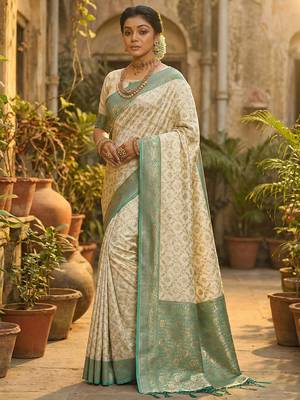 Ivory and sea green banarasi silk blend saree with golden zari   1