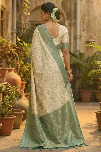 Ivory and sea green banarasi silk blend saree with golden zari  