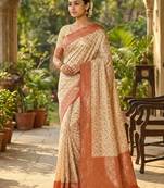 Ivory and red banarasi silk saree with golden zari – regal elegance for timeless celebrations