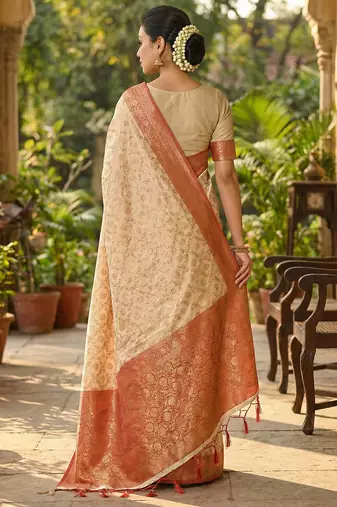 Ivory and red banarasi silk blend saree with golden zari  