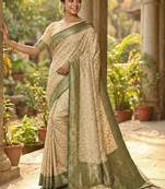 Ivory and green banarasi silk saree with golden zari     regal elegance for timeless celebrations