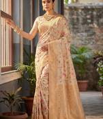 Graceful white banarasi silk saree with golden zari woven border & floral jaal     wedding & festive wear