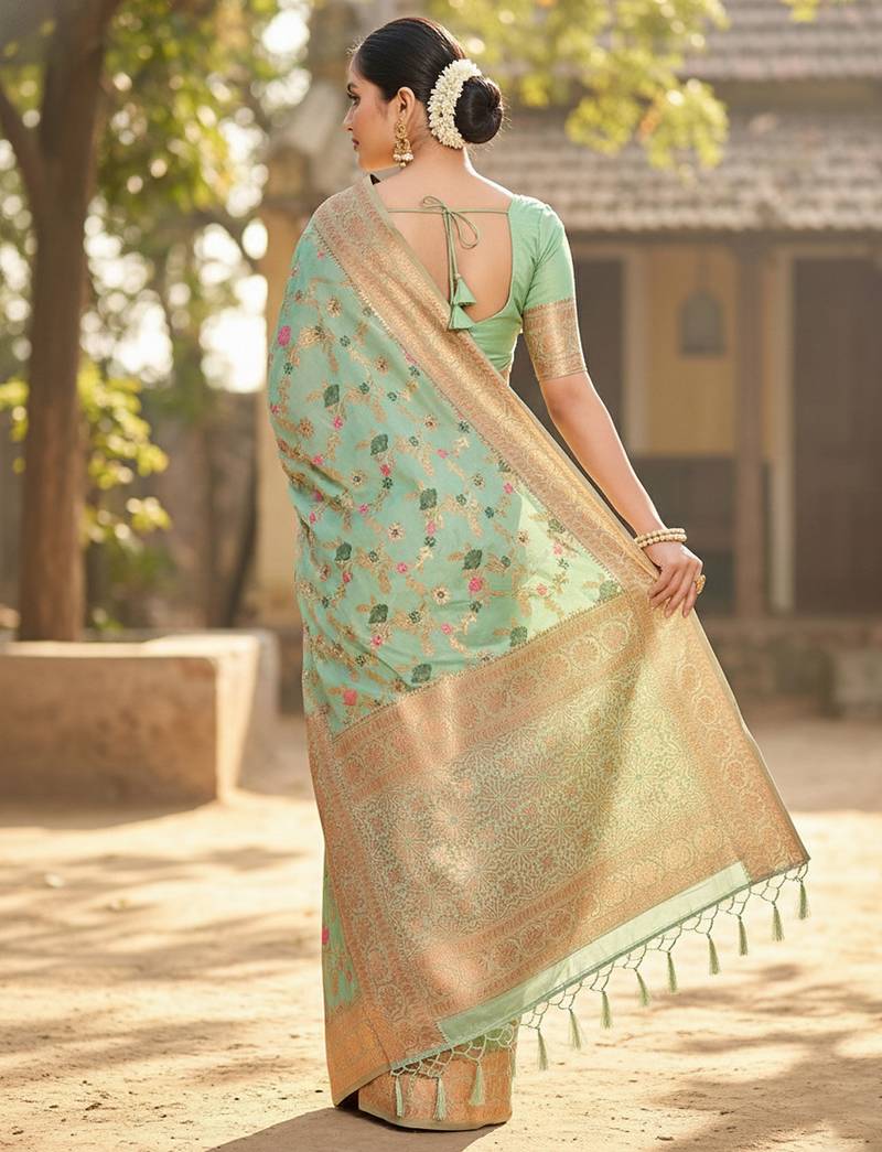 Graceful sea green banarasi silk saree with golden zari woven border & floral jaal     wedding & festive wear