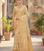Graceful light green banarasi silk saree with golden zari woven border & floral jaal     wedding & festive wear