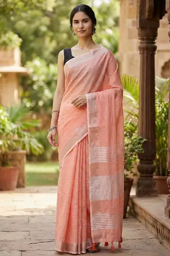 Elegant peach woven linen saree with contrast zari border & tassels     soft & breathable party wear