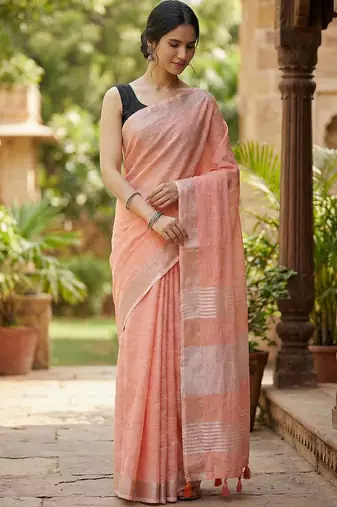 Elegant peach woven linen saree with contrast zari border & tassels  soft & breathable party wear