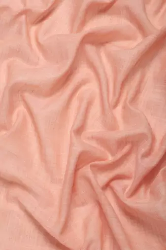 Elegant peach woven linen saree with contrast zari border & tassels  soft & breathable party wear
