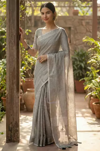 Elegant grey woven linen saree with contrast zari border & tassels     soft & breathable party wear