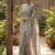 Elegant grey woven linen saree with contrast zari border & tassels     soft & breathable party wear