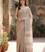 Elegant brown woven linen saree with contrast zari border & tassels     soft & breathable party wear