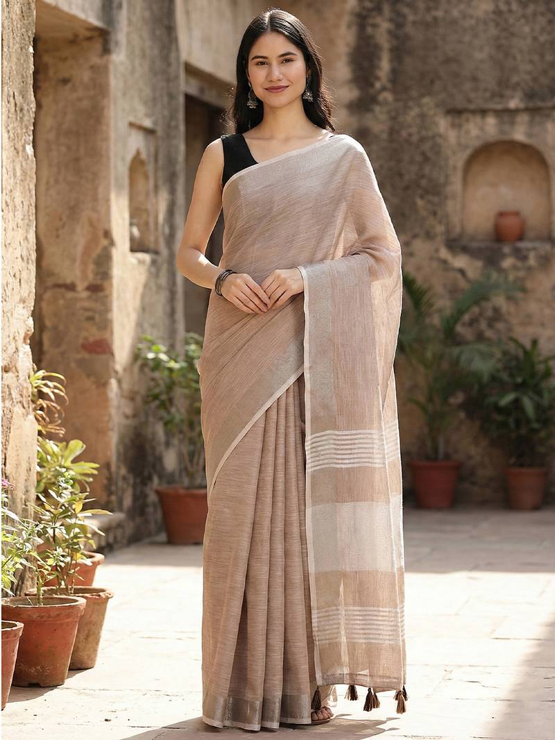 Elegant brown woven linen saree with contrast zari border & tassels     soft & breathable party wear