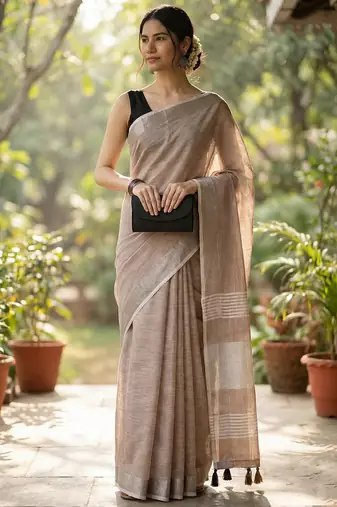 Elegant brown woven linen saree with contrast zari border & tassels  soft & breathable party wear
