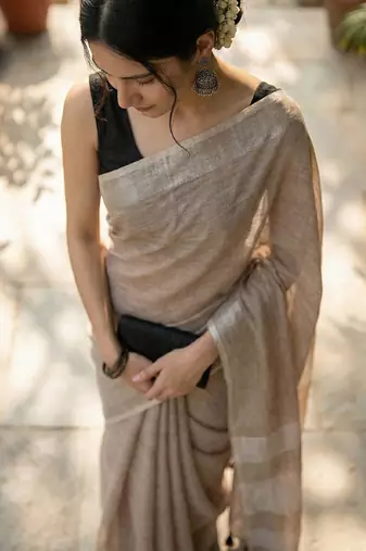 Elegant brown woven linen saree with contrast zari border & tassels  soft & breathable party wear