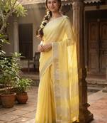Elegant yellow woven linen saree with contrast zari border & tassels     soft & breathable party wear