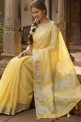 Elegant yellow woven linen saree with contrast zari border & tassels  soft & breathable party wear
