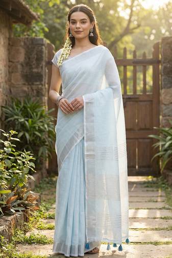 Elegant sky blue woven linen saree with contrast zari border & tassels     soft & breathable party wear