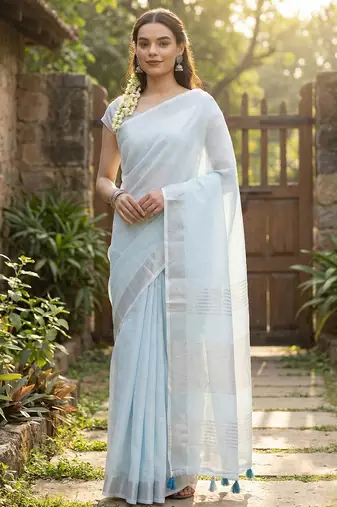 Elegant sky blue woven linen saree with contrast zari border & tassels     soft & breathable party wear