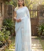 Elegant sky blue woven linen saree with contrast zari border & tassels     soft & breathable party wear