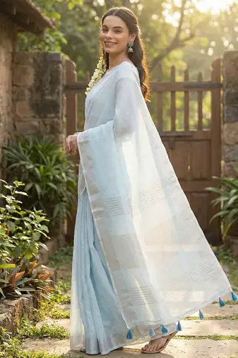 Elegant sky blue woven linen saree with contrast zari border & tassels  soft & breathable party wear