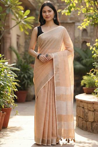 Elegant tan woven linen saree with contrast zari border & tassels     soft & breathable party wear