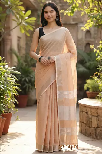 Elegant tan woven linen saree with contrast zari border & tassels     soft & breathable party wear