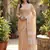 Elegant tan woven linen saree with contrast zari border & tassels   soft & breathable party wear