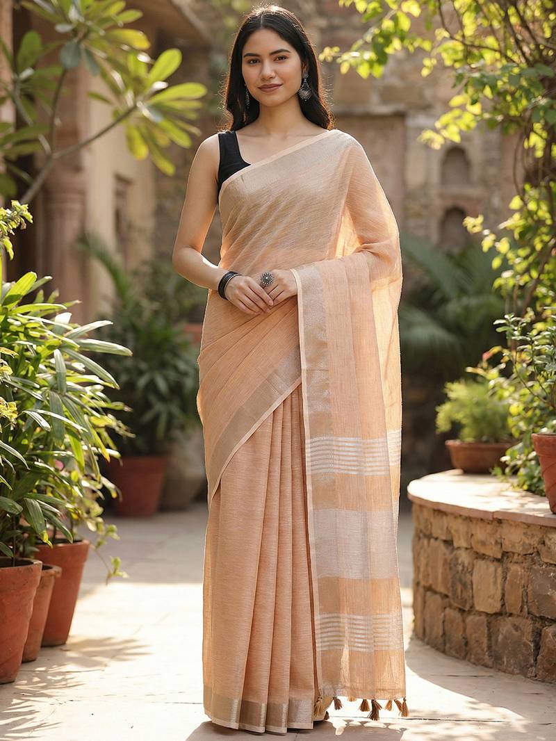 Elegant tan woven linen saree with contrast zari border & tassels     soft & breathable party wear