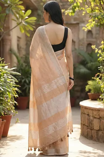 Elegant tan woven linen saree with contrast zari border & tassels  soft & breathable party wear