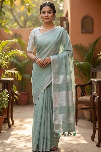 Elegant sea green woven linen saree with contrast zari border & tassels     soft & breathable party wear