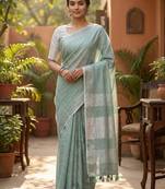 Elegant sea green woven linen saree with contrast zari border & tassels     soft & breathable party wear