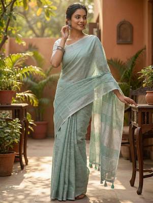 Elegant sea green woven linen saree with contrast zari border & tassels  soft & breathable party wear 2