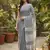 Elegant dark grey woven linen saree with contrast zari border & tassels     soft & breathable party wear