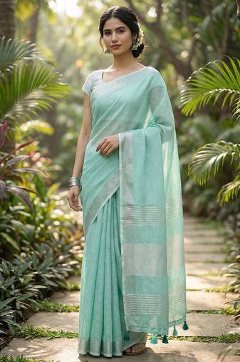 Elegant turquoise woven linen saree with contrast zari border & tassels     soft & breathable party wear