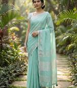 Elegant turquoise woven linen saree with contrast zari border & tassels     soft & breathable party wear