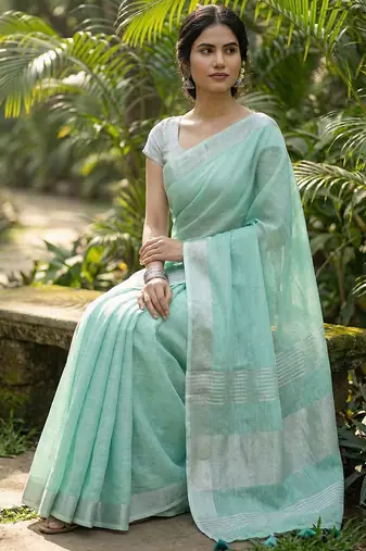 Elegant turquoise woven linen saree with contrast zari border & tassels  soft & breathable party wear