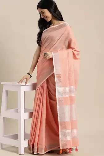 Elegant peach woven linen saree with contrast zari border & tassels  soft & breathable party wear