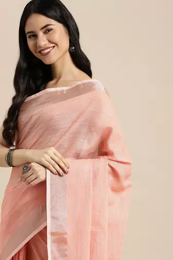 Elegant peach woven linen saree with contrast zari border & tassels  soft & breathable party wear