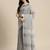 Elegant grey woven linen saree with contrast zari border & tassels     soft & breathable party wear