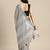 Elegant grey woven linen saree with contrast zari border & tassels     soft & breathable party wear