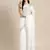 Elegant white woven linen saree with contrast zari border & tassels   soft & breathable party wear