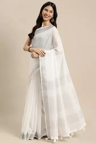 Elegant white woven linen saree with contrast zari border & tassels  soft & breathable party wear