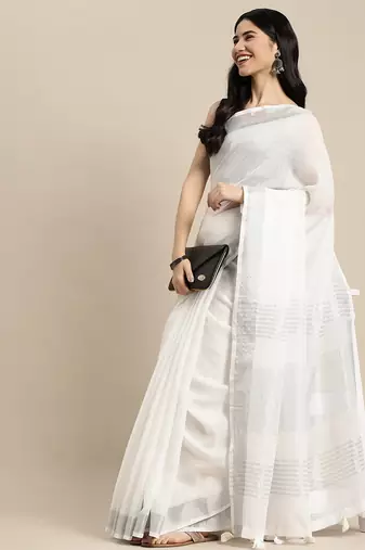Elegant white woven linen saree with contrast zari border & tassels  soft & breathable party wear