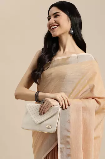 Elegant tan woven linen saree with contrast zari border & tassels  soft & breathable party wear