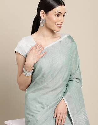 Elegant sea green woven linen saree with contrast zari border & tassels  soft & breathable party wear 4