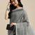 Elegant dark grey woven linen saree with contrast zari border & tassels     soft & breathable party wear