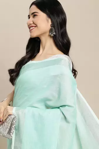 Elegant turquoise woven linen saree with contrast zari border & tassels  soft & breathable party wear