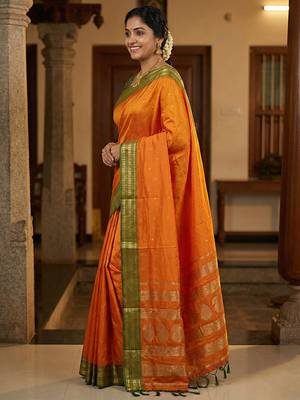 The sunset glow: vibrant orange soft silk blend saree with contrast green zari border 2