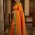 The sunset glow: vibrant orange soft silk saree with contrast green zari border