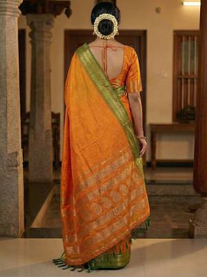 The sunset glow: vibrant orange soft silk blend saree with contrast green zari border 3